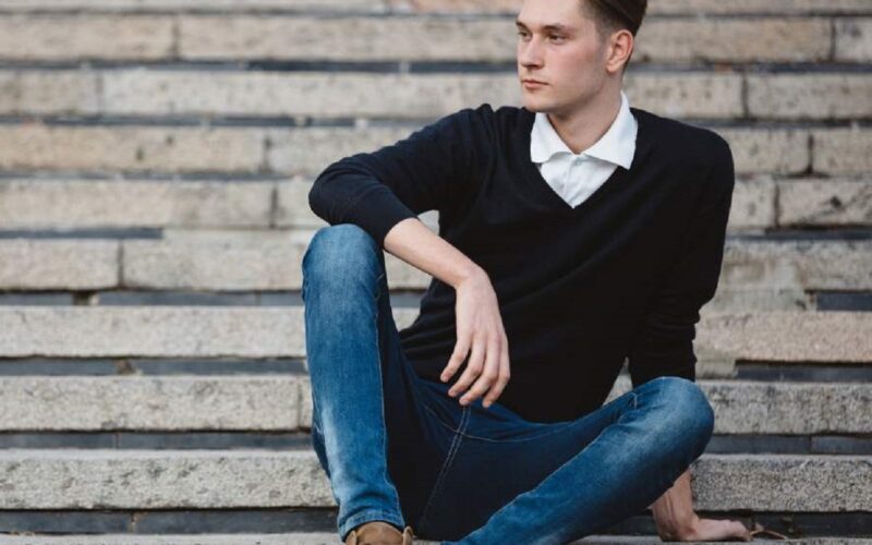 fashionable, handsome man wearing black shirts with brown shoes