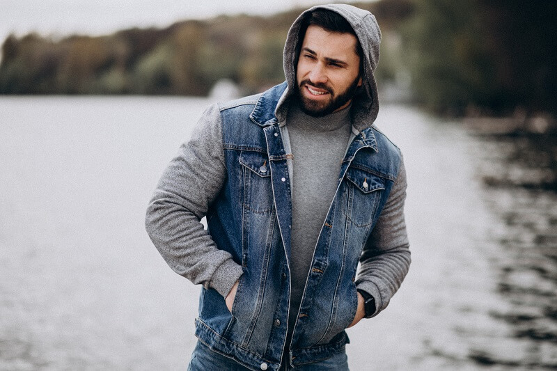 good-looking-bearded-man-by-river-park