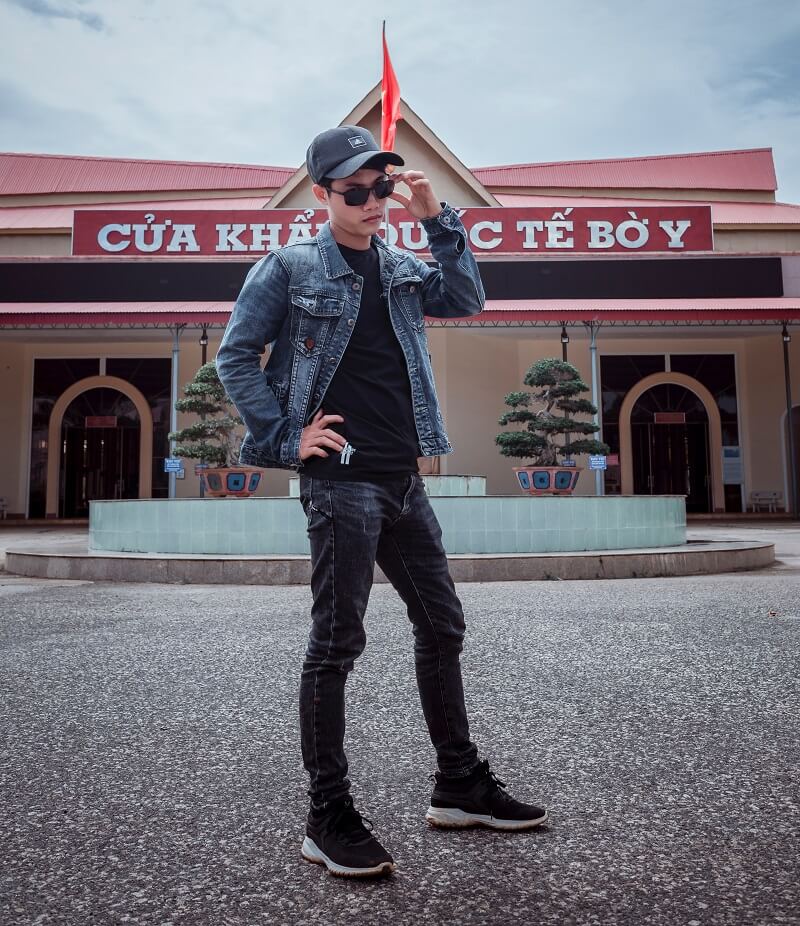 boy wearing denim jacket with polo shirt and black pant